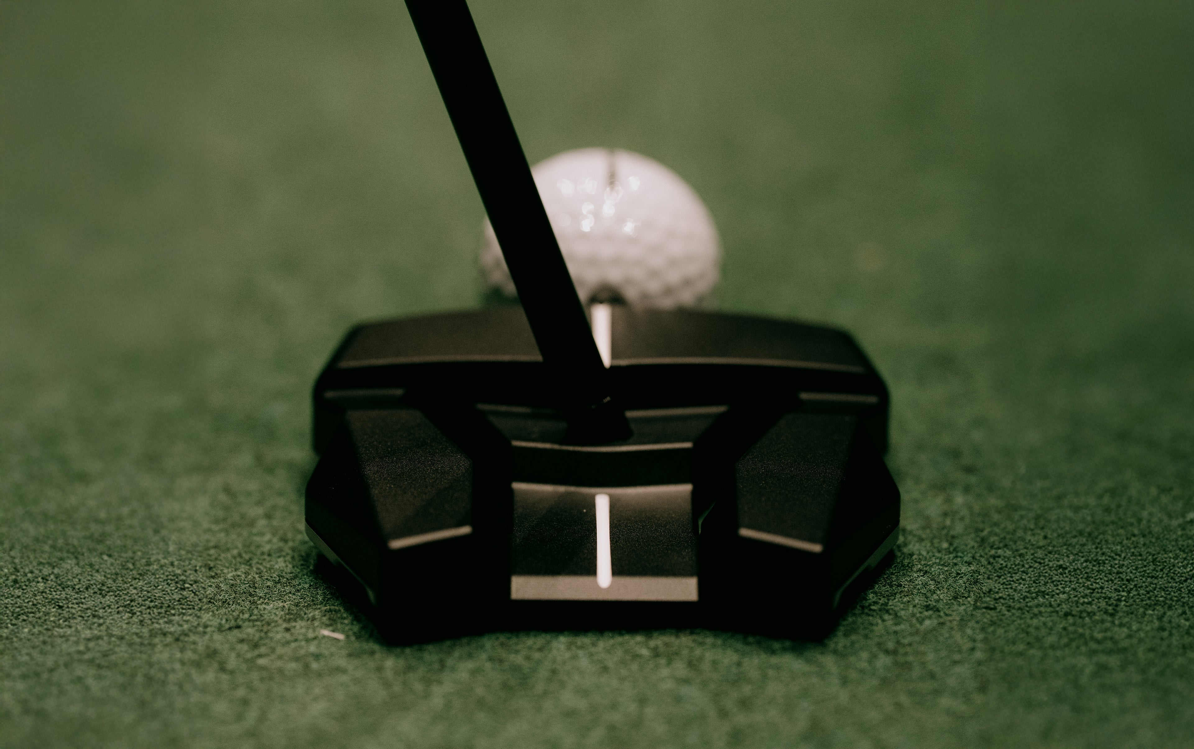 Hot Rod Putter with golf ball on green grass