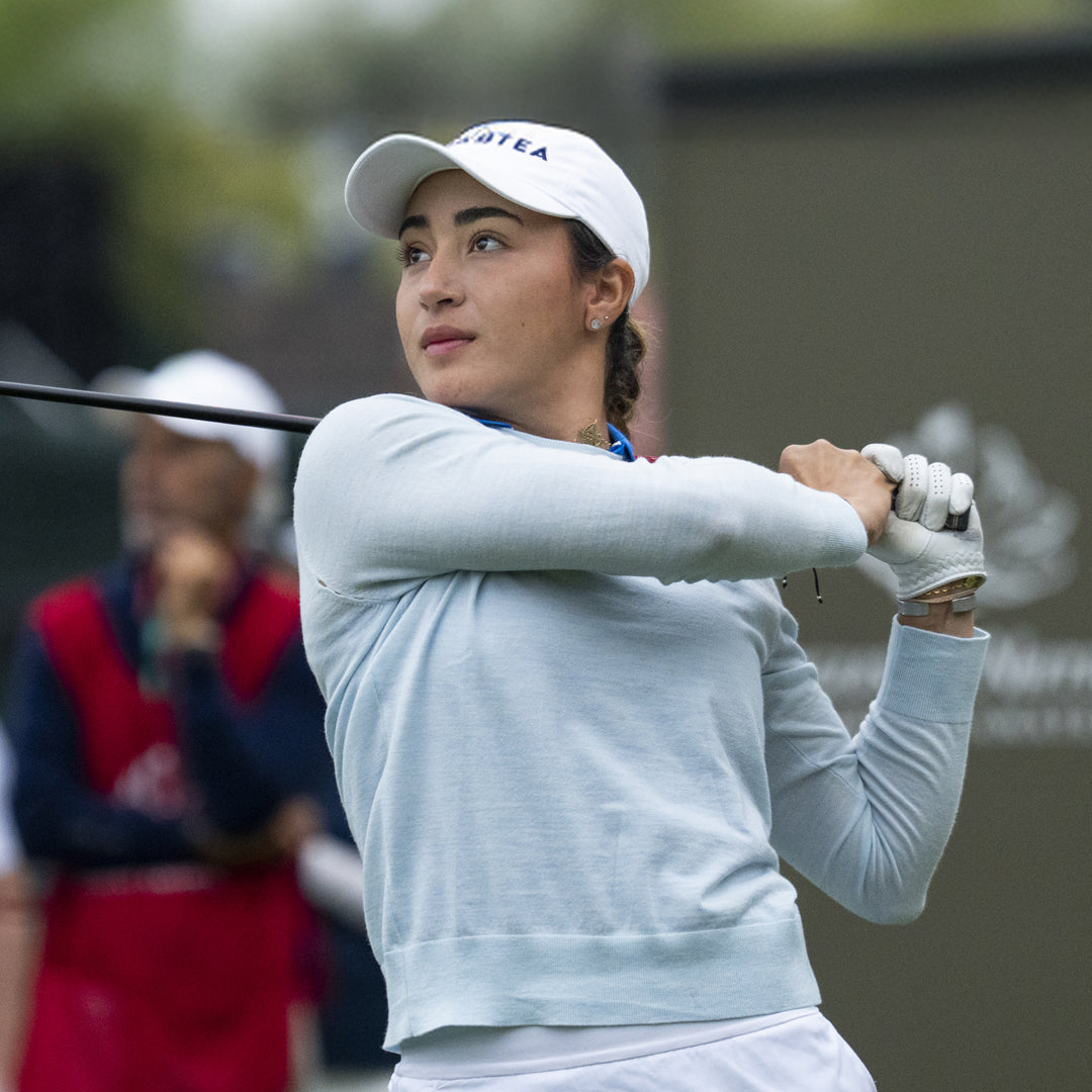 Golfer in action with a blurred background