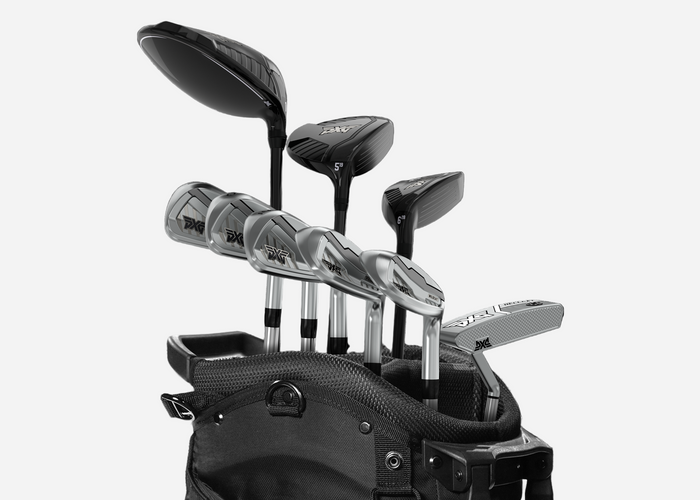 Set of golf clubs in a black bag on a white background